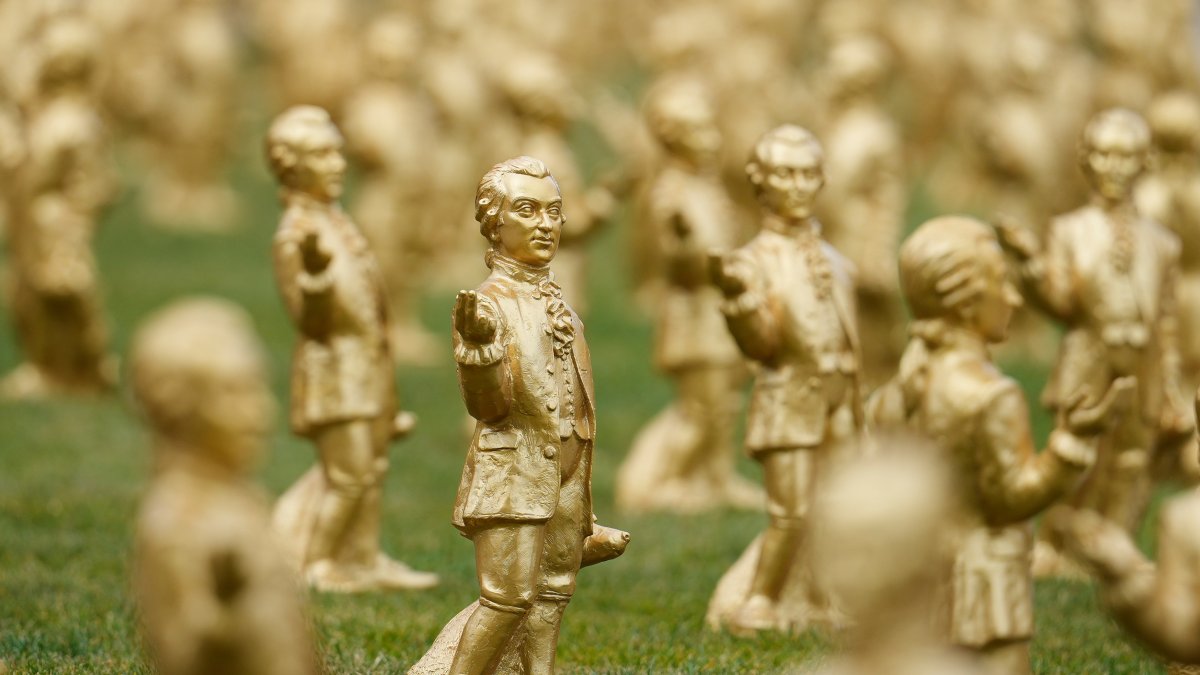 A view of some of the 400 gold colored plastic Mozart sculptures by German artist Ottmar Hoerl from Nuremberg for the 270th birthday of composer Wolfgang Amadeus Mozart, Salzburg, Austria, July 15, 2026. (AP Photo)