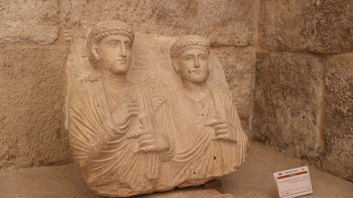 Syrian artifacts returned from France are displayed at the Throne Hall of the Damascus Citadel during a summer festival, Damascus, Syria, Aug. 7, 2026. (AA Photo)