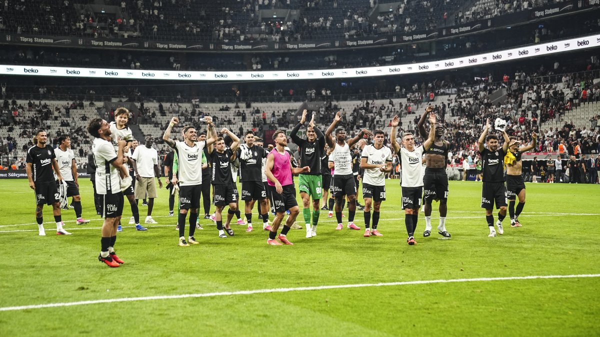 Beşiktaş players greet the fans after advancing to the UEFA Europa League playoff round after defeating Czech side Hradec Kralove 1-0 in the second leg of the third qualifying round tie at Tüpraş Stadium in Istanbul, Türkiye, Aug. 13, 2026. (AA Photo)