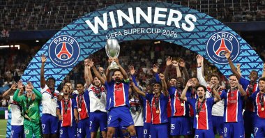 Paris Saint-Germain's Marquinhos (C) hoists the trophy after winning the UEFA Super Cup football match against Aston Villa, Salzburg, Austria, Aug. 12, 2026. (AFP Photo)