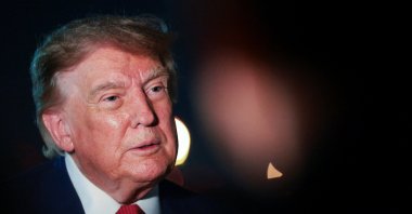 U.S. President Donald Trump looks on as he speaks to members of the media after disembarking Air Force One at Joint Base Andrews, Maryland, U.S., Aug. 11, 2026. (Reuters Photo)