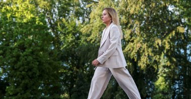 Italian Prime Minister Giorgia Meloni walks during the official arrivals ceremony for the G-7 summit, Evian-les-Bains, France, June 15, 2026. (AP Photo)
