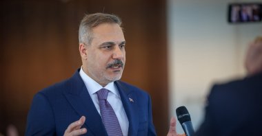 Foreign Minister Hakan Fidan speaks to reporters before departing following a series of meetings, Benghazi, Libya, Aug. 12, 2026. (DHA Photo)