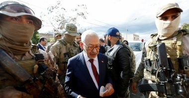 Tunisia's Rached Ghannouchi, head of the Ennahda party, is surrounded by presidential guard members, Tunis, Tunisia, April 1, 2022. (Reuters Photo)