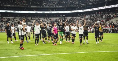 Beşiktaş players greet the fans after advancing to the UEFA Europa League playoff round after defeating Czech side Hradec Kralove 1-0 in the second leg of the third qualifying round tie at Tüpraş Stadium in Istanbul, Türkiye, Aug. 13, 2026. (AA Photo)