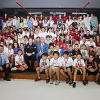 Students pose with SpaceX’s Inspiration4 crew member Chris Sembroski in Izmir, western Türkiye, Aug. 14, 2026. (AA Photo)