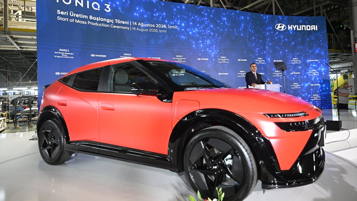 Hyundai's new all-electric IONIQ 3 model is on display as Industry and Technology Minister Mehmet Fatih Kacır delivers a speech at a factory, Kocaeli, Türkiye, Aug. 14, 2026. (AA Photo)
