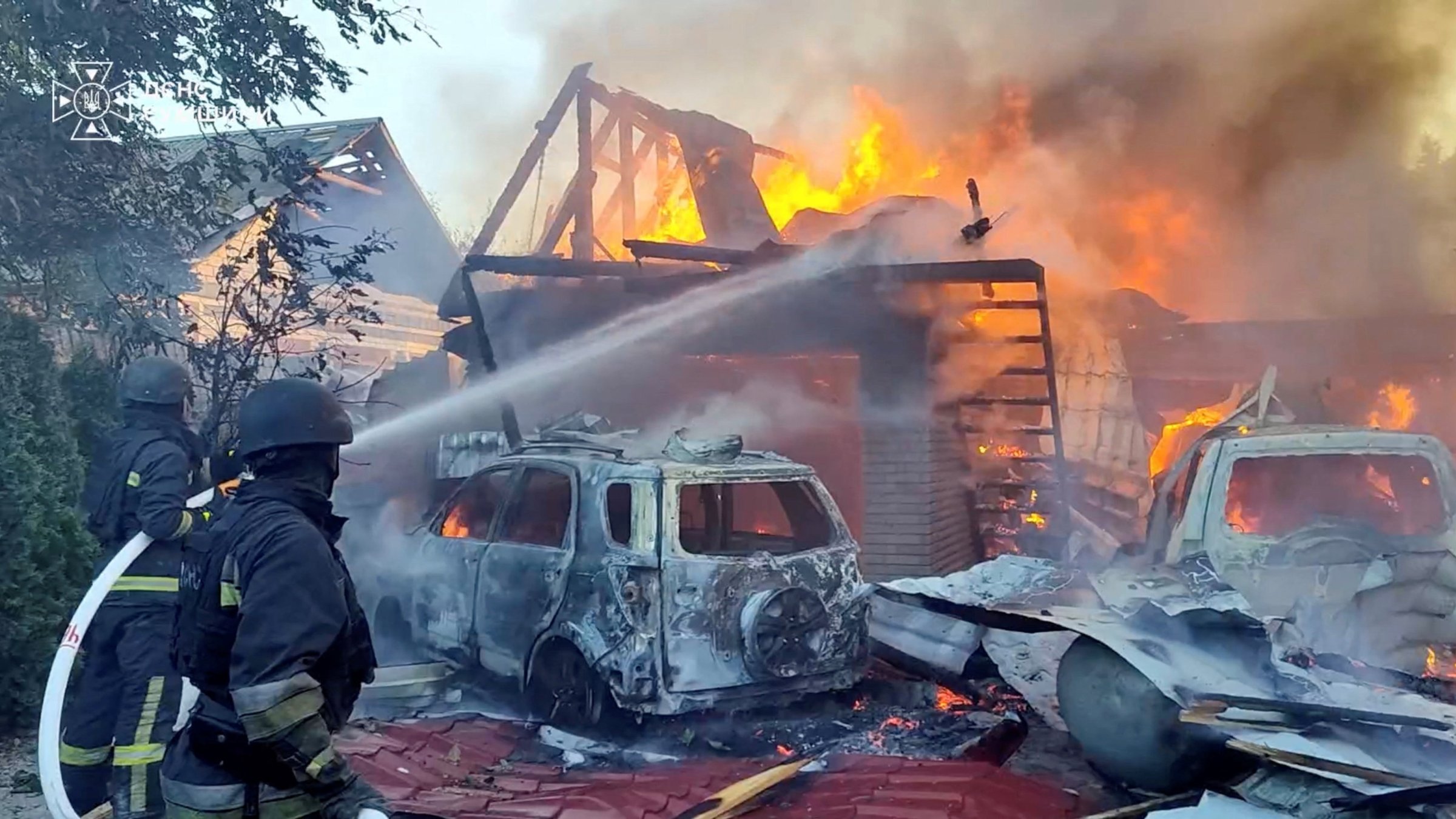 Firefighters put out a fire at the site of a reported Russian strike, amid Russia's attack on Ukraine, in a location given as Sumy Region, Ukraine, in this screengrab from a handout video released Aug. 14, 2026.  (Reuters Photo)