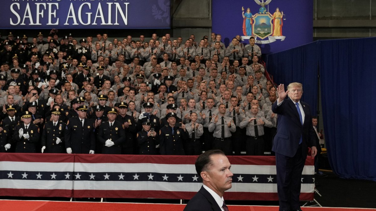 U.S. President Donald Trump waves during an event at David S. Mack Center for Training and Intelligence in Garden City, New York, U.S., Aug. 14, 2026. (Reuters Photo)