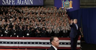 U.S. President Donald Trump waves during an event at David S. Mack Center for Training and Intelligence in Garden City, New York, U.S., Aug. 14, 2026. (Reuters Photo)