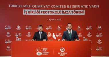 Turkish Olympic Committee (TMOK) President Prof. Dr. Veli Ozan Çakır (L) and Zero Waste Foundation President Samed Ağırbaş pose for a photo after signing a cooperation protocol, Istanbul, Türkiye, Aug. 12, 2026. (Courtesy of Zero Waste Foundation)