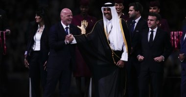 (L-R) FIFA President Gianni Infantino, the Emir of Qatar, Sheikh Tamim bin Hamad Al Thani and the French President Emmanuel Macron arrive for the trophy presentation at the end of the World Cup final match between Argentina and France at the Lusail Stadium, Lusail, Qatar, Dec.18, 2022. (AP Photo)