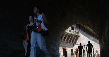 People walk in the famous Eminönü neighborhood in Istanbul, Türkiye, July 28, 2026. (AA Photo)
