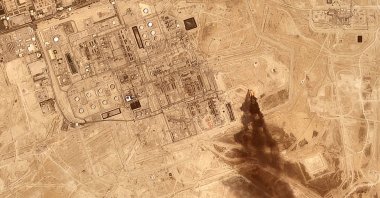 This satellite image provided by Planet Labs PBC on July 27, 2026 shows smoke rising from the Saudi Aramco oil processing facility in Abqaiq, Saudi Arabia, 2026. (Planet Labs PBC via AP)