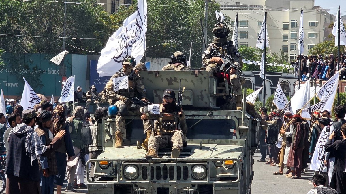 Members of the Taliban attend a rally to mark five years in power, outside the former U.S. embassy, Kabul, Afghanistan, Aug.15, 2026. (Reuters Photo)