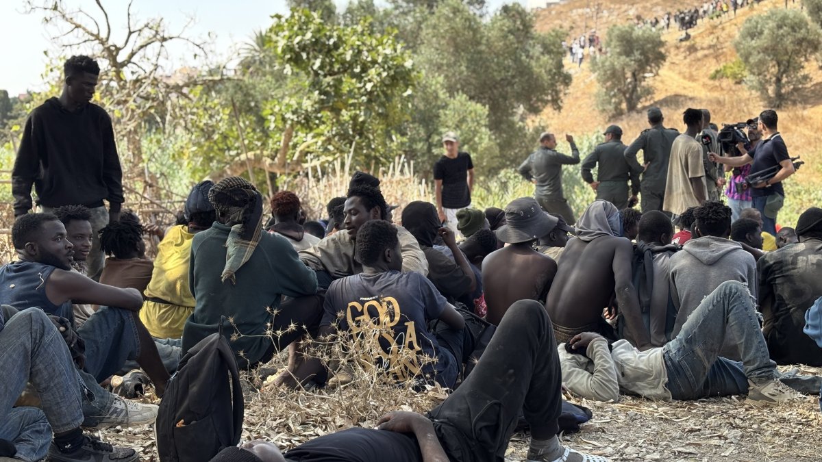 People intercepted by Moroccan security forces during an attempt by dozens of sub-Saharan migrants, who had gathered on the outskirts of the border town of Castillejos, to cross into the Spanish city of Ceuta, Castillejos, Morocco, Aug. 15, 2026. (EPA Photo)