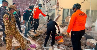 Rescuers work amid the rubble of a damaged building after an earthquake in Maumere, East Nusa Tenggara, Indonesia, Aug. 15, 2026. (AFP Photo)