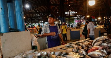 A vendor sells fresh fish at a market as local fishermen are increasingly being pursued by Ecuadorian gangs to move drugs and for their skills in navigating the Pacific waters along Ecuador's coast, which has become a hub for the international smuggling of narcotics over the last half-decade, Manta, Ecuador, June 4, 2026. (Reuters Photo)