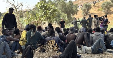 People intercepted by Moroccan security forces during an attempt by dozens of sub-Saharan migrants, who had gathered on the outskirts of the border town of Castillejos, to cross into the Spanish city of Ceuta, Castillejos, Morocco, Aug. 15, 2026. (EPA Photo)