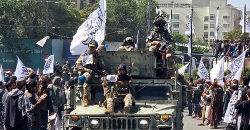 Members of the Taliban attend a rally to mark five years in power, outside the former U.S. embassy, Kabul, Afghanistan, Aug.15, 2026. (Reuters Photo)