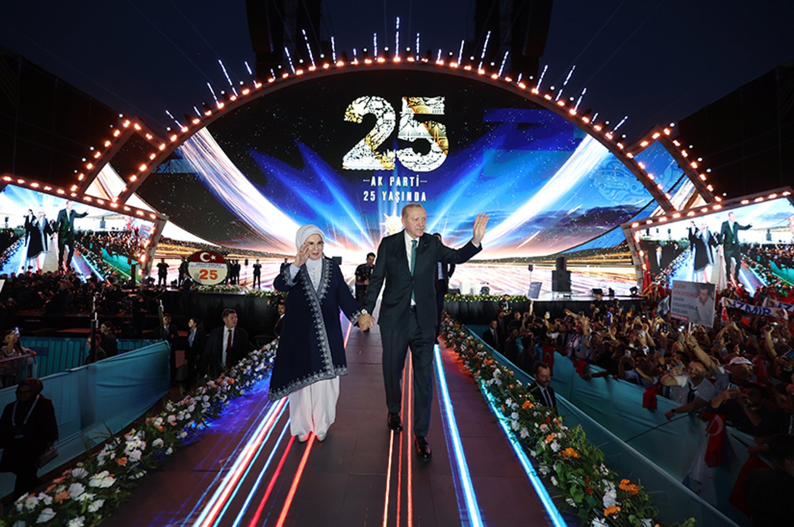 President Recep Tayyip Erdoğan (R) and First Lady Emine Erdoğan wave to supporters during the AK Party’s 25th anniversary, Ankara, Türkiye, Aug. 14, 2026. (IHA Photo)