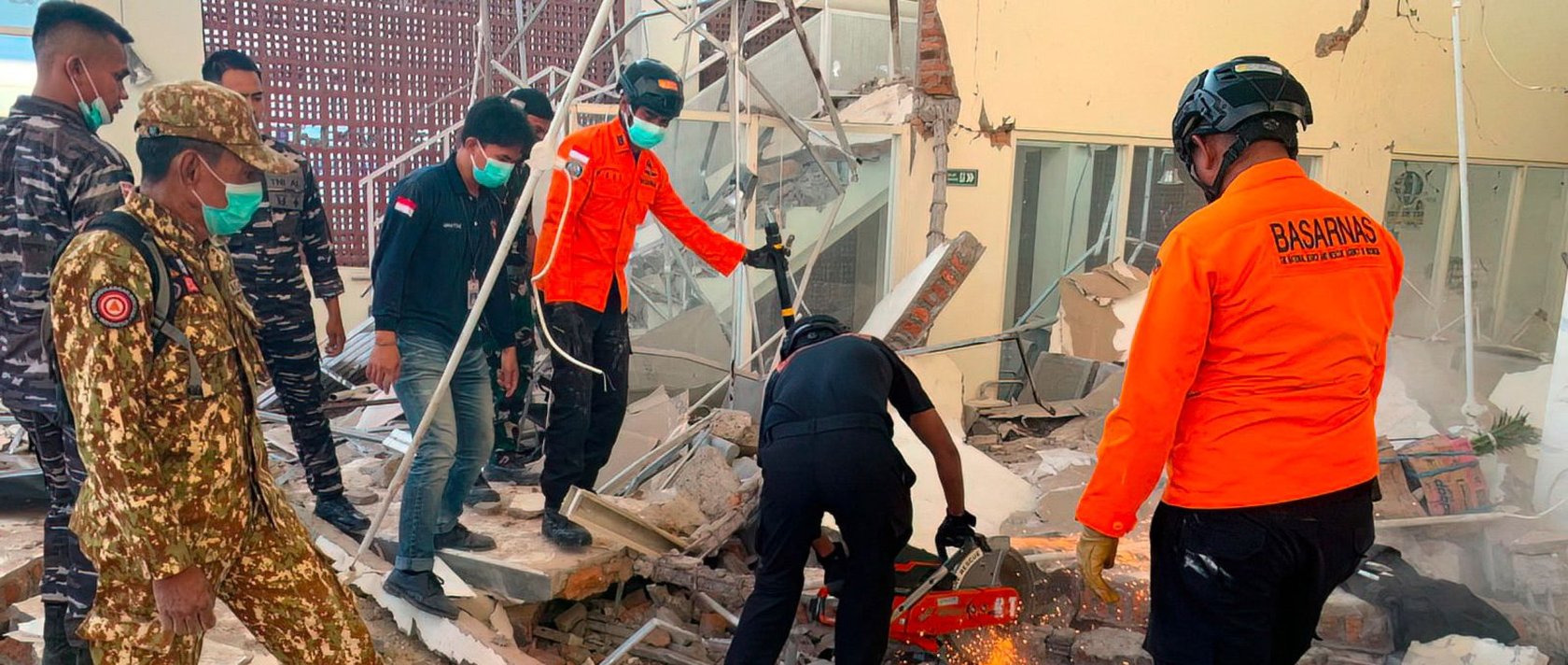 Rescuers work amid the rubble of a damaged building after an earthquake in Maumere, East Nusa Tenggara, Indonesia, Aug. 15, 2026. (AFP Photo)