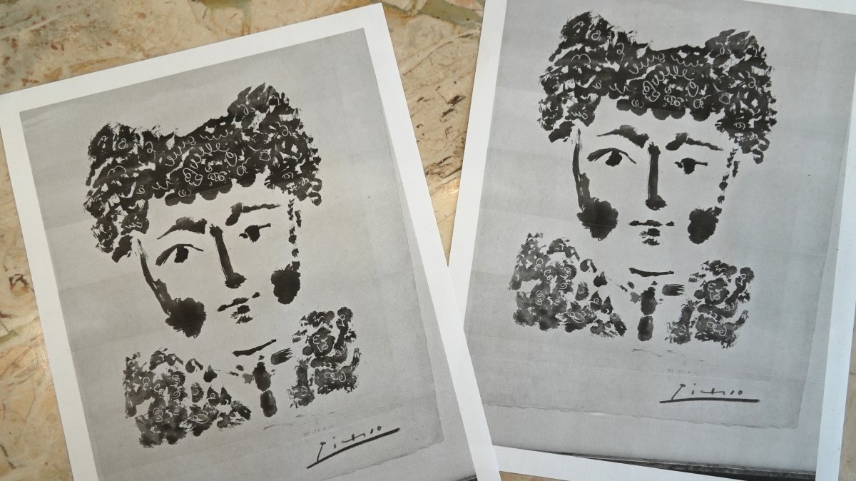 Printouts of a photo of the Pablo Picasso etching, "Torero" are displayed on a table in DeLind Fine Art Appraisals in Milwaukee, U.S., Aug. 14, 2026. (AP Photo)