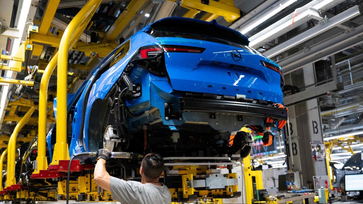An employee works on a production line of the car brand Opel, assembling Opel Astra passenger cars at the company’s plant, Ruesselsheim, Germany, June 30, 2026. (AFP Photo)