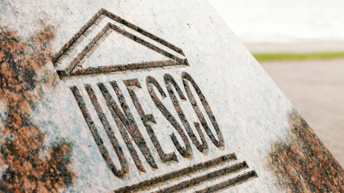 An undated close up view of UNESCO World Heritage sign carved on stone. (Shutterstock Photo)
