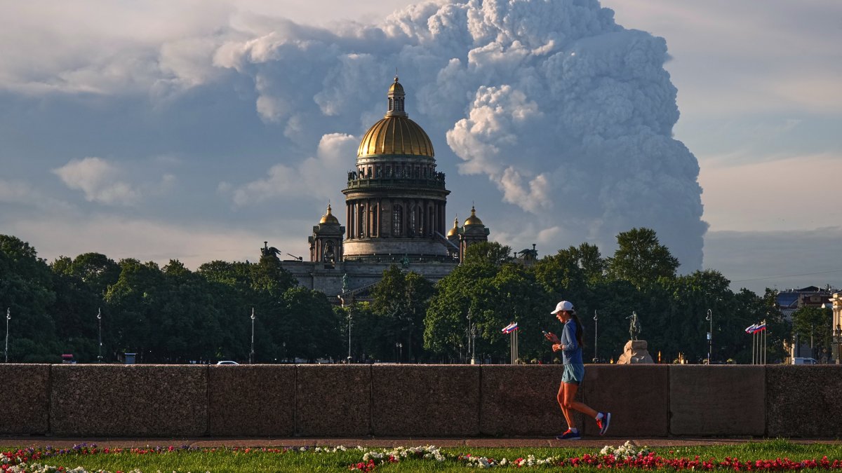 Smoke rises following a Ukrainian drone attack on a warehouse for online retailer Wildberries, with St. Isaac's Cathedral seen in the foreground, St. Petersburg, Russia, July 24, 2026. (AP Photo)