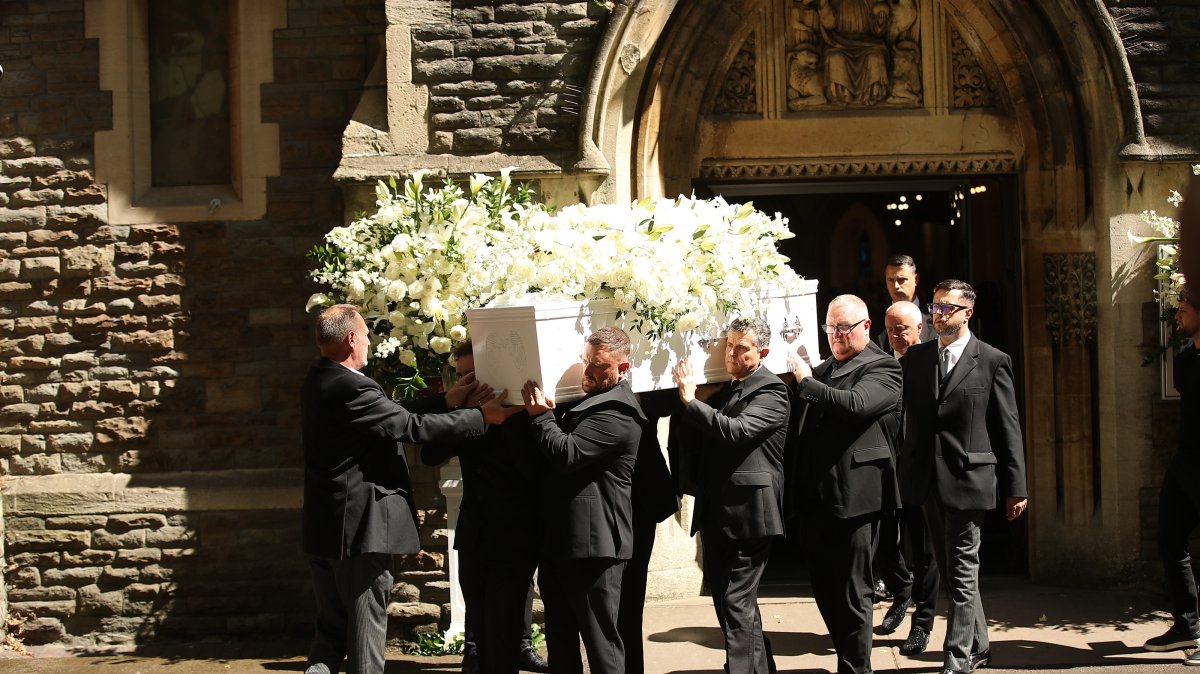 The coffin of Welsh singer Bonnie Tyler is carried out after a celebration of her life at St Mary's Church, Swansea Minster, Wales, U.K., Aug. 17, 2026. (EPA Photo)