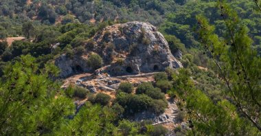 An aerial view of the caves in Bornova Homeros Valley, believed to be where the famous Greek Poet Homer lived and wrote the "Iliad" and the "Odyssey," Izmir, Türkiye, Aug. 7, 2026. (AFP Photo)