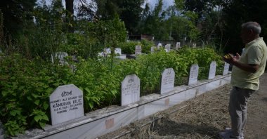 Nusret Atasoy, who lost his two sons and relatives in the 1999 Marmara earthquake, prays at their graves on the disaster’s 27th anniversary, Düzce, Türkiye, Aug. 14, 2026. (AA Photo)
