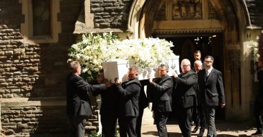 The coffin of Welsh singer Bonnie Tyler is carried out after a celebration of her life at St Mary's Church, Swansea Minster, Wales, U.K., Aug. 17, 2026. (EPA Photo)
