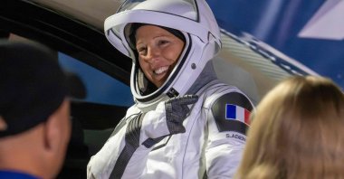 ESA (European Space Agency) astronaut Sophie Adenot points to the French flag on her shoulder before traveling to the SpaceX Falcon 9 rocket with the company's Dragon spacecraft at Space Launch Complex 40 for the Crew-12 mission at Cape Canaveral Space Force Station, Florida, U.S., Feb. 13, 2026. (AFP Photo)