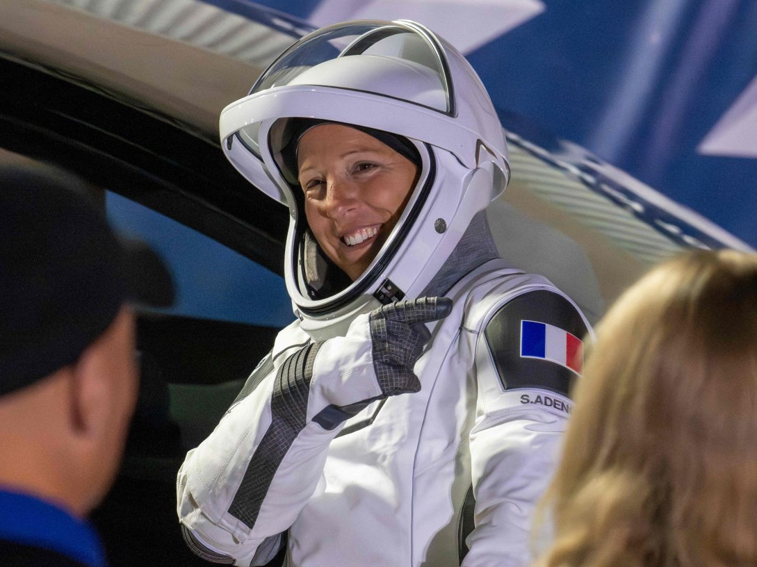 ESA (European Space Agency) astronaut Sophie Adenot points to the French flag on her shoulder before traveling to the SpaceX Falcon 9 rocket with the company's Dragon spacecraft at Space Launch Complex 40 for the Crew-12 mission at Cape Canaveral Space Force Station, Florida, U.S., Feb. 13, 2026. (AFP Photo)