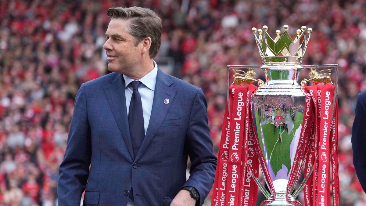 Chief Executive Officer of the Premier League, Richard Masters, poses with the Premier League trophy after the English Premier League match between Liverpool and Crystal Palace at Anfield Stadium, Liverpool, U.K., May 25, 2025. (AP Photo)