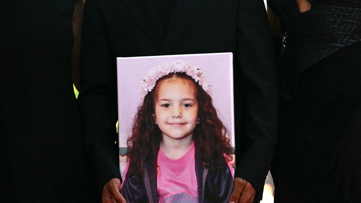 Guests hold a portrait of late Palestinian girl Hind Rajab during the red carpet for the movie "The Voice of Hind Rajab" presented in competition at the 82nd International Venice Film Festival, at Venice Lido, Sept. 3, 2025. (AFP Photo) 