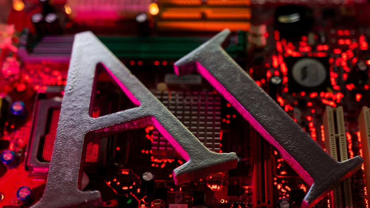 AI (Artificial Intelligence) letters are placed on a computer motherboard, June 23, 2023. (Reuters File Photo)