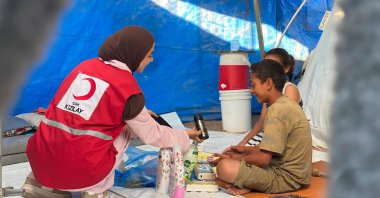 The Turkish Red Crescent (Kızılay) distributes drinking water and hygiene kits daily in Gaza, where outbreaks of infectious diseases are on the rise due to poor hygiene conditions and high temperatures, Gaza, Palestine, Aug. 9, 2026. (İHA Photo)