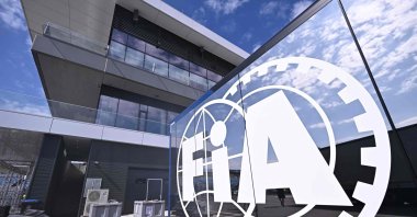 The logo of FIA is seen with the Hungaroring's new main building in the background during a press presentation at the renovated Mogyorod circuit, Budapest, Hungary, July 21, 2026. (AFP Photo)