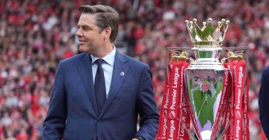 Chief Executive Officer of the Premier League, Richard Masters, poses with the Premier League trophy after the English Premier League match between Liverpool and Crystal Palace at Anfield Stadium, Liverpool, U.K., May 25, 2025. (AP Photo)