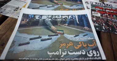 Copies of the Iranian daily newspaper Hamshahri carrying a title that reads in Persian 'The Strait of Hormuz remains closed' on display outside a kiosk in Tehran, Iran, Aug. 19, 2026. (EPA Photo)