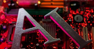 AI (Artificial Intelligence) letters are placed on a computer motherboard, June 23, 2023. (Reuters File Photo)
