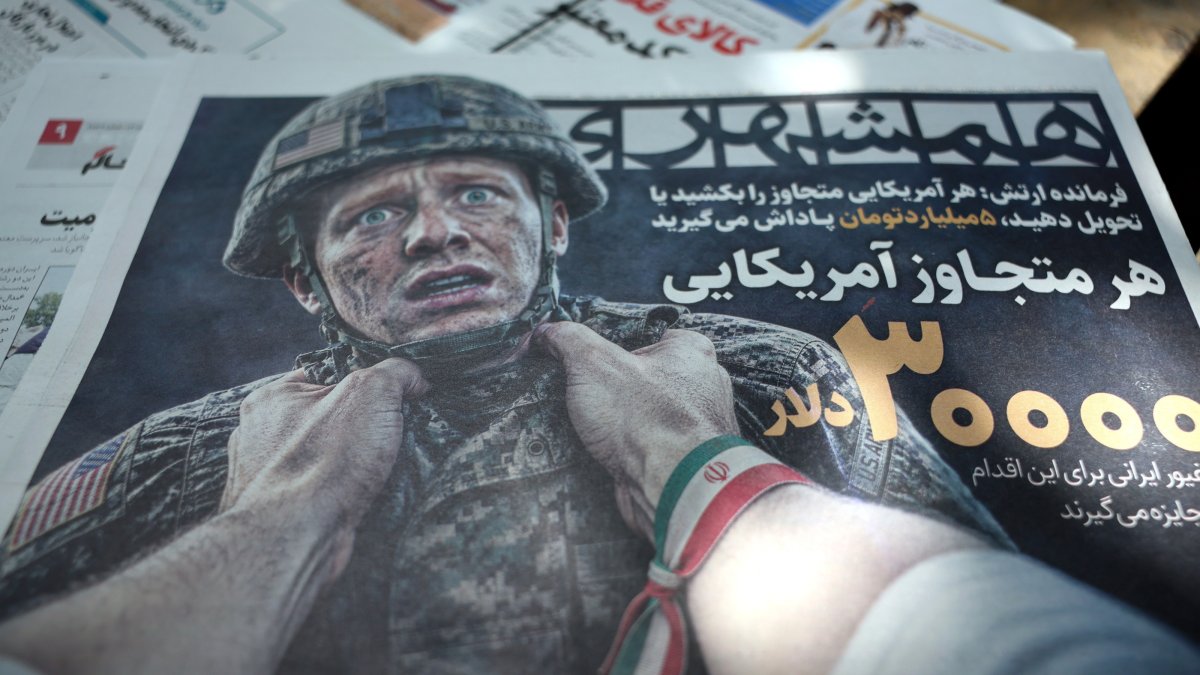 A copy of the Iranian daily newspaper Hamshahri depicting a U.S. soldier is displayed outside a kiosk in Tehran, Iran, Aug. 17, 2026. (EPA Photo)