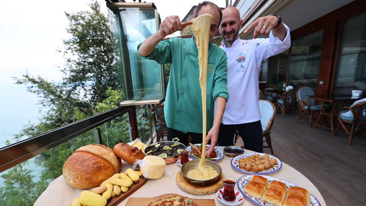 A chef serves kuymak alongside kaygana, collard-green rolls, cornbread, Trabzon butter and other traditional Black Sea dishes, Trabzon, Türkiye, Aug. 18, 2026. (AA Photo)