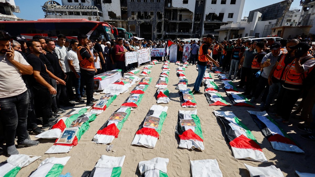 Palestinians attend the funeral of 50 people from three families killed by Israel, whose bodies were retrieved from under the rubble recently, Gaza City, Palestine, Aug. 20, 2026. (Reuters Photo)