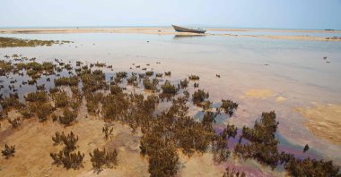 An oil slick along the southern coast of Qeshm Island is seen as tankers have been frequently targeted in the Gulf region, Iran, Aug. 23, 2026. (AFP Photo)