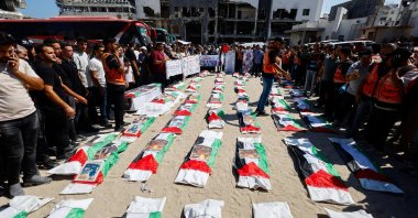 Palestinians attend the funeral of 50 people from three families killed by Israel, whose bodies were retrieved from under the rubble recently, Gaza City, Palestine, Aug. 20, 2026. (Reuters Photo)