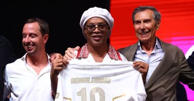 Ronaldinho poses with his new team shirt as he is presented as a new player for Ravenna FC in Ravenna, Italy, Aug. 20, 2026. (Reuters Photo)